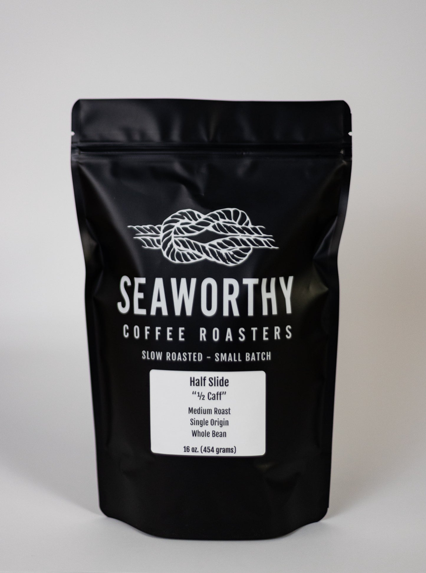 Seaworthy slow roasted, small batch, low acid coffee. 1 pound bag of Half Slide medium roast specialty half decaf coffee.