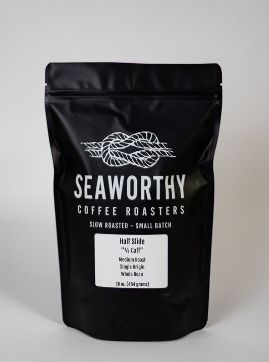 Seaworthy slow roasted, small batch coffee.  Need a coffee after 3pm?  Want a rich and flavorful cup of coffee but not all the caffeine?  Half Slide is 1/2 the caff and all of the flavor.  A 50/50 mix of Brazil and Way Enough Swiss Water Process Decaf, this coffee is rich, flavorful, chocolatey, and satisfying.  You would never know it has 1/2 the caff if the bag didn't say it!