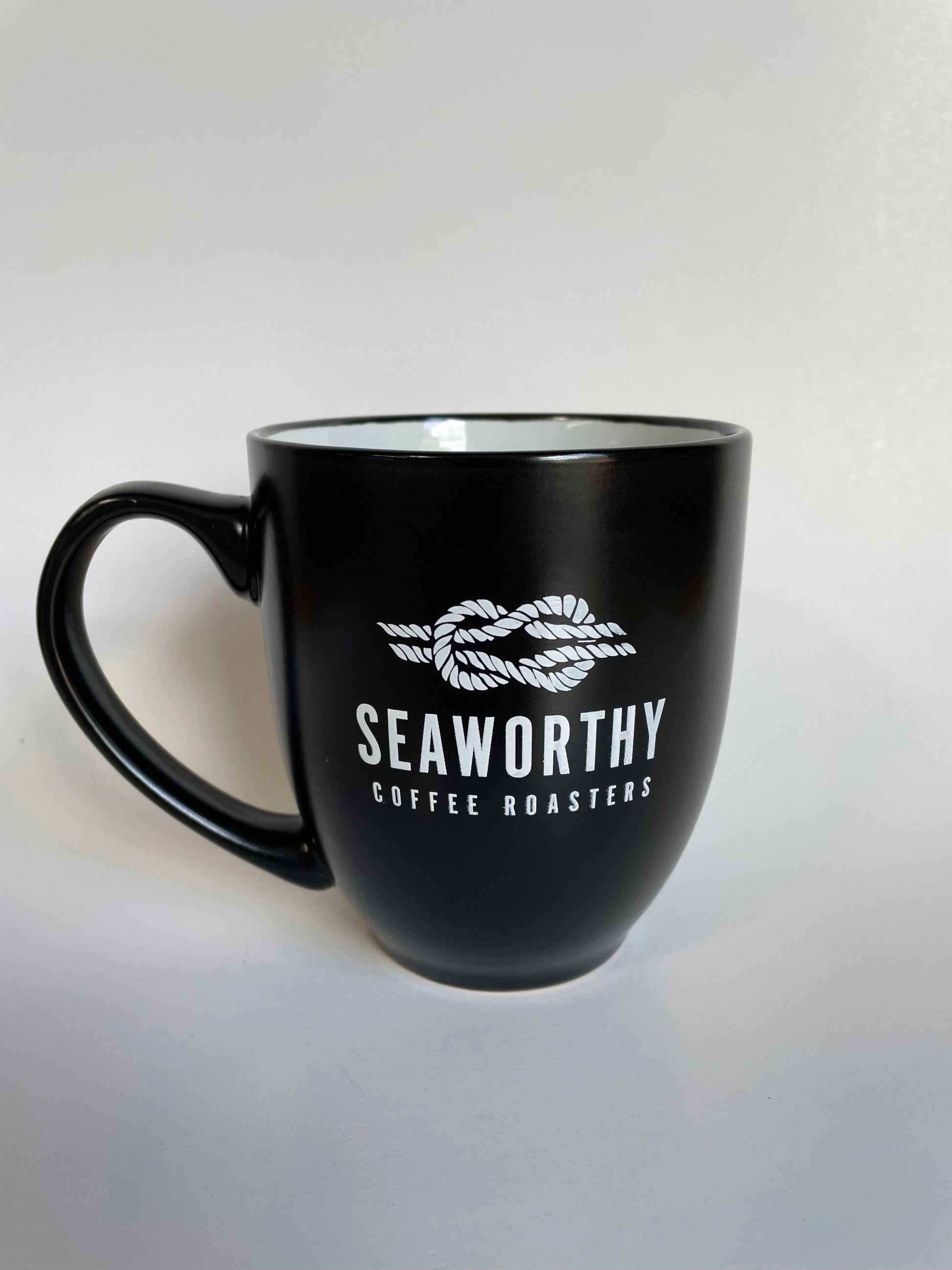 Our second edition mugs are here!  The Seaworthy Black & White Ceramic Mug has a 16 ounce capacity, features a nice big handle, and looks sharp with our slow roasted coffee in it.  